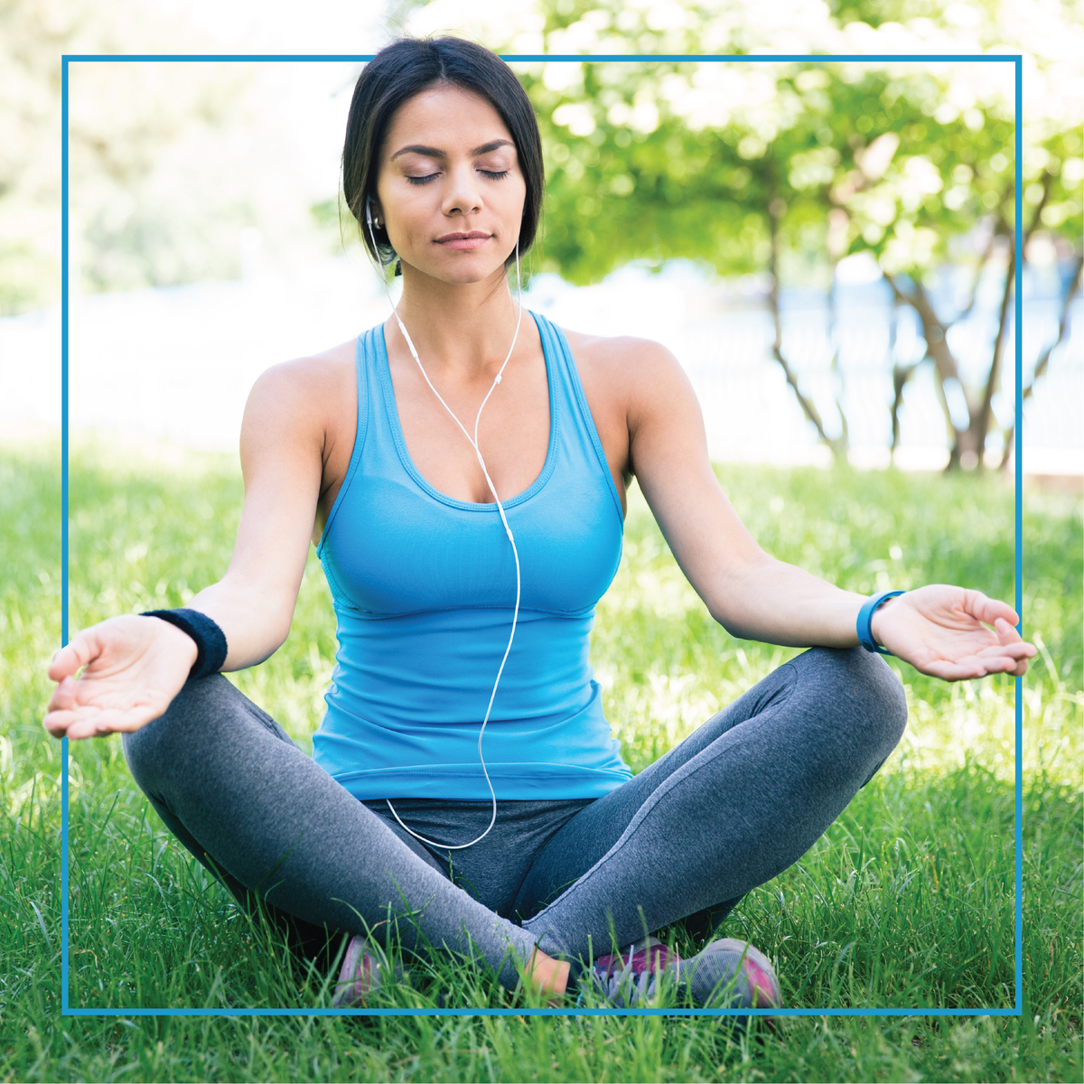 A woman doing meditation on grass