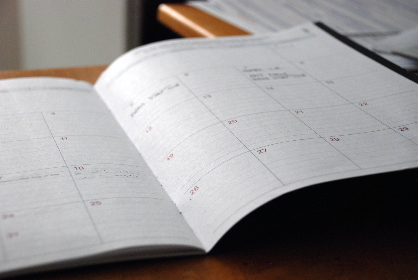 A calendar open on a desk