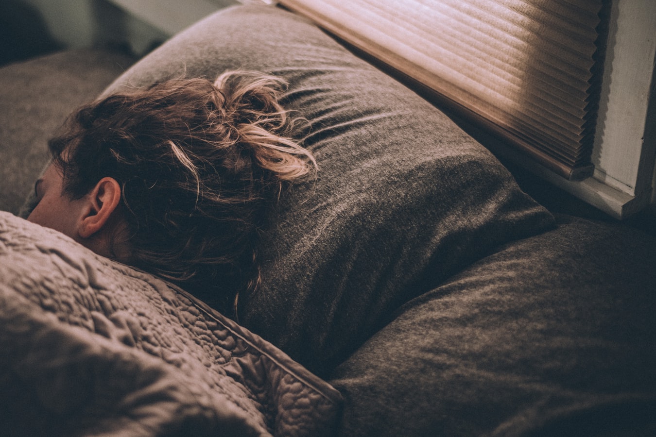 A woman sleeping in bed