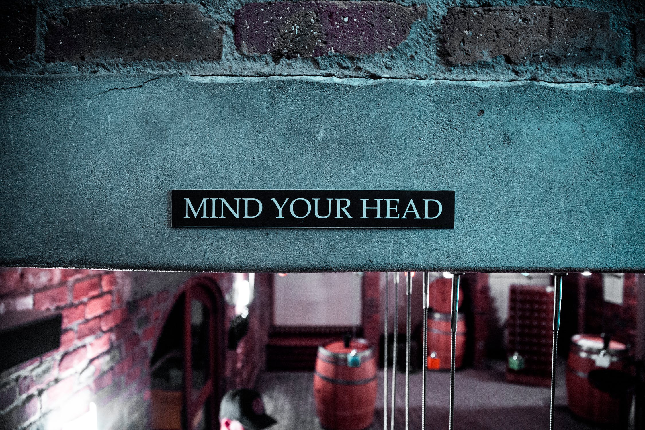 A sign that reads “mind your head”