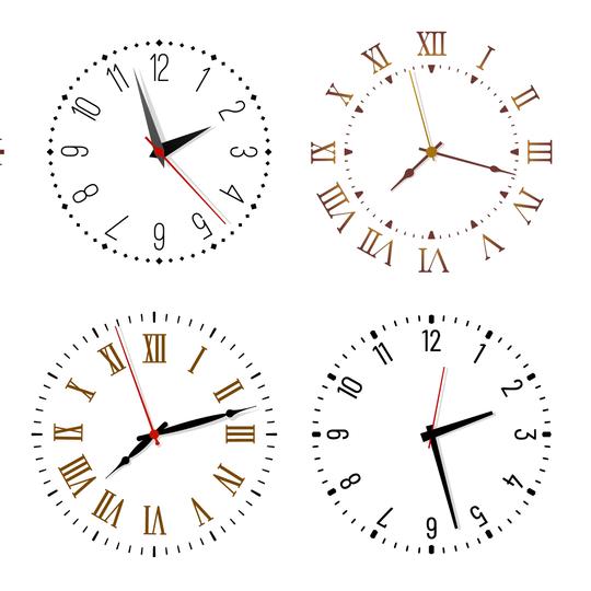 Four different wall clocks showing various times with Roman numerals