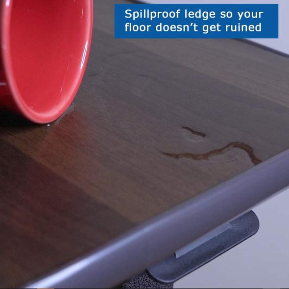 A close-up of a cup spilled on the top of the Carex Overbed Table Text Spillproof ledge so your floor doesn’t get ruined