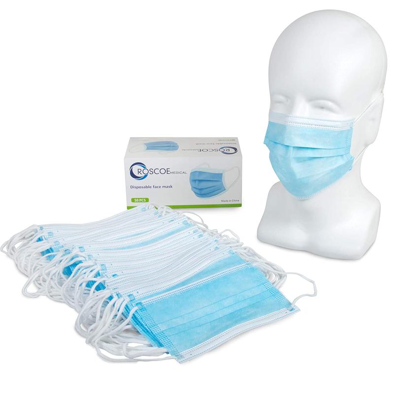 Facemasks next to a mannequin with a face mask and box