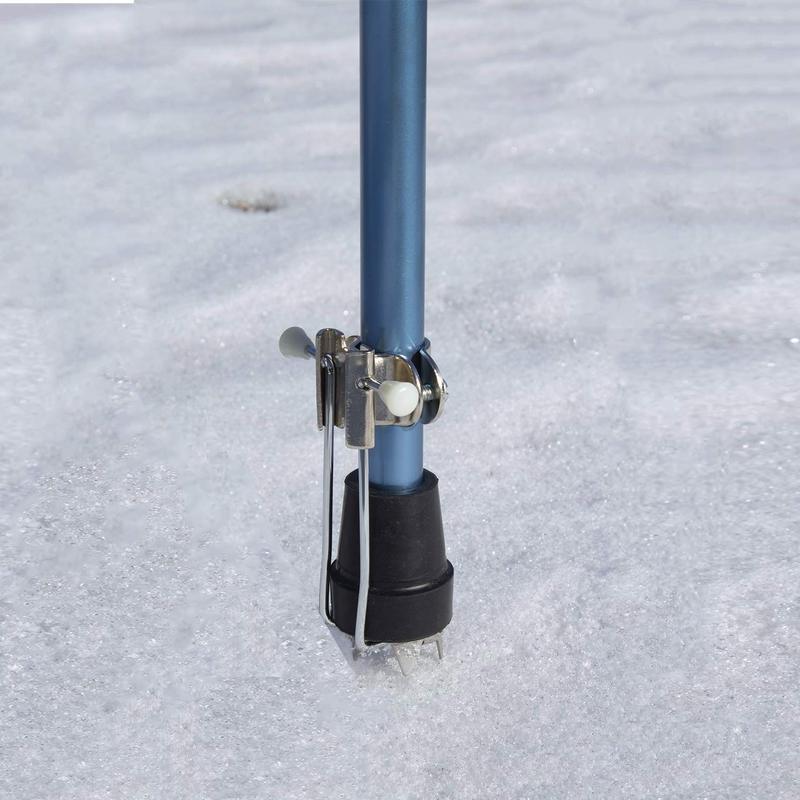 A walking cane in snow with a snow tip