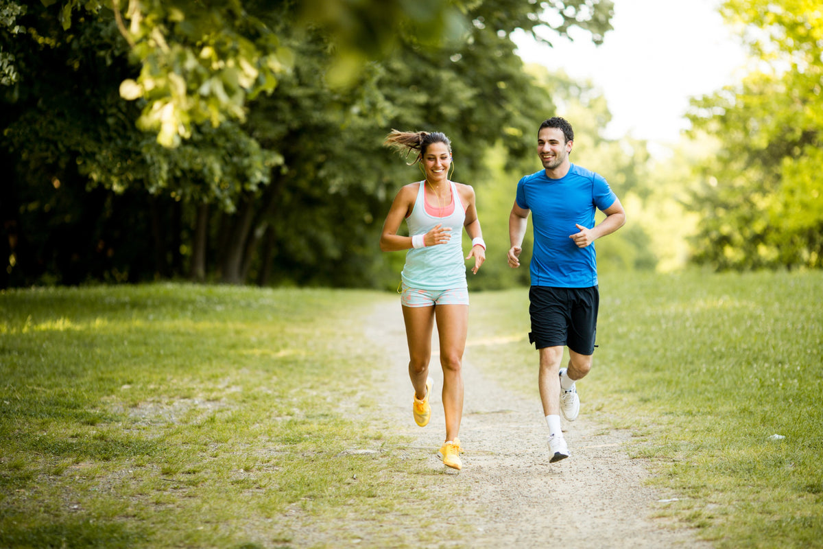 A couple running in a park