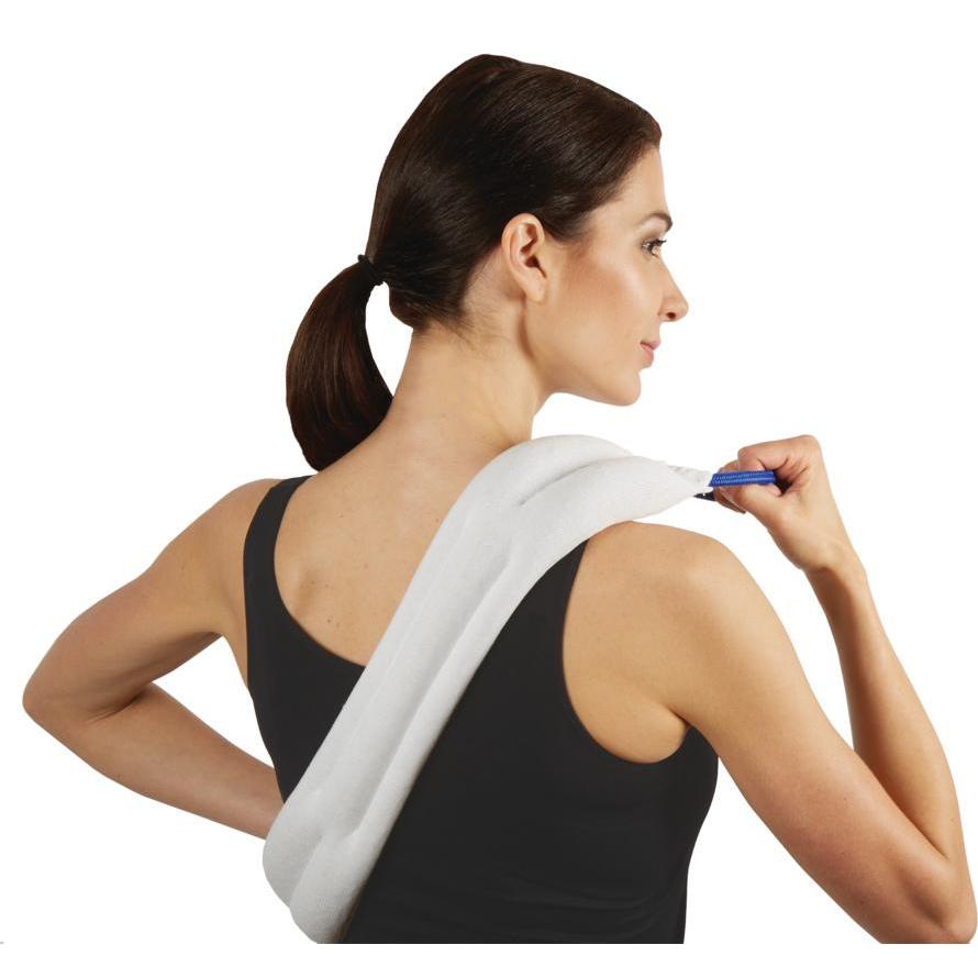 Woman holding a hot/cold wrap over her back.