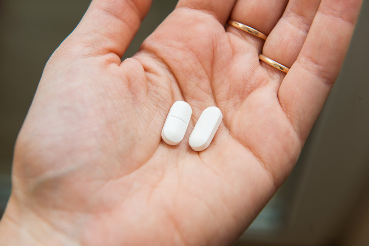 Pills in a person’s hand