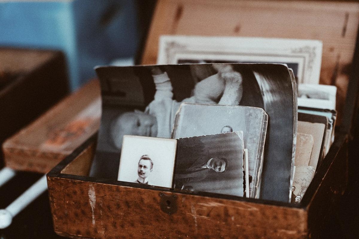 Various vintage images in a wooden box