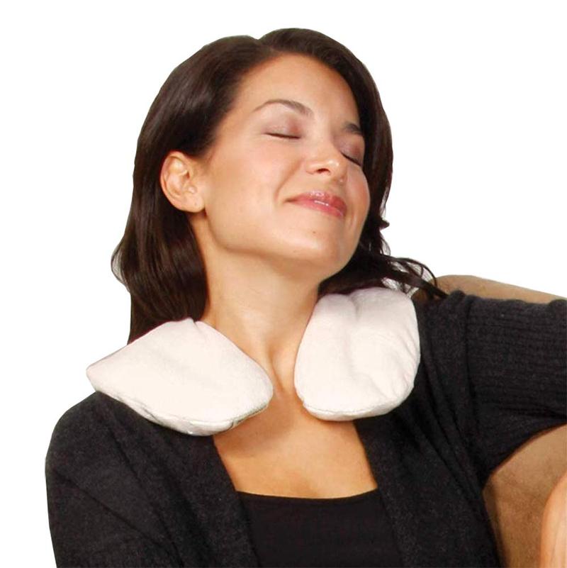 A woman relaxing with a neck pillow on her neck