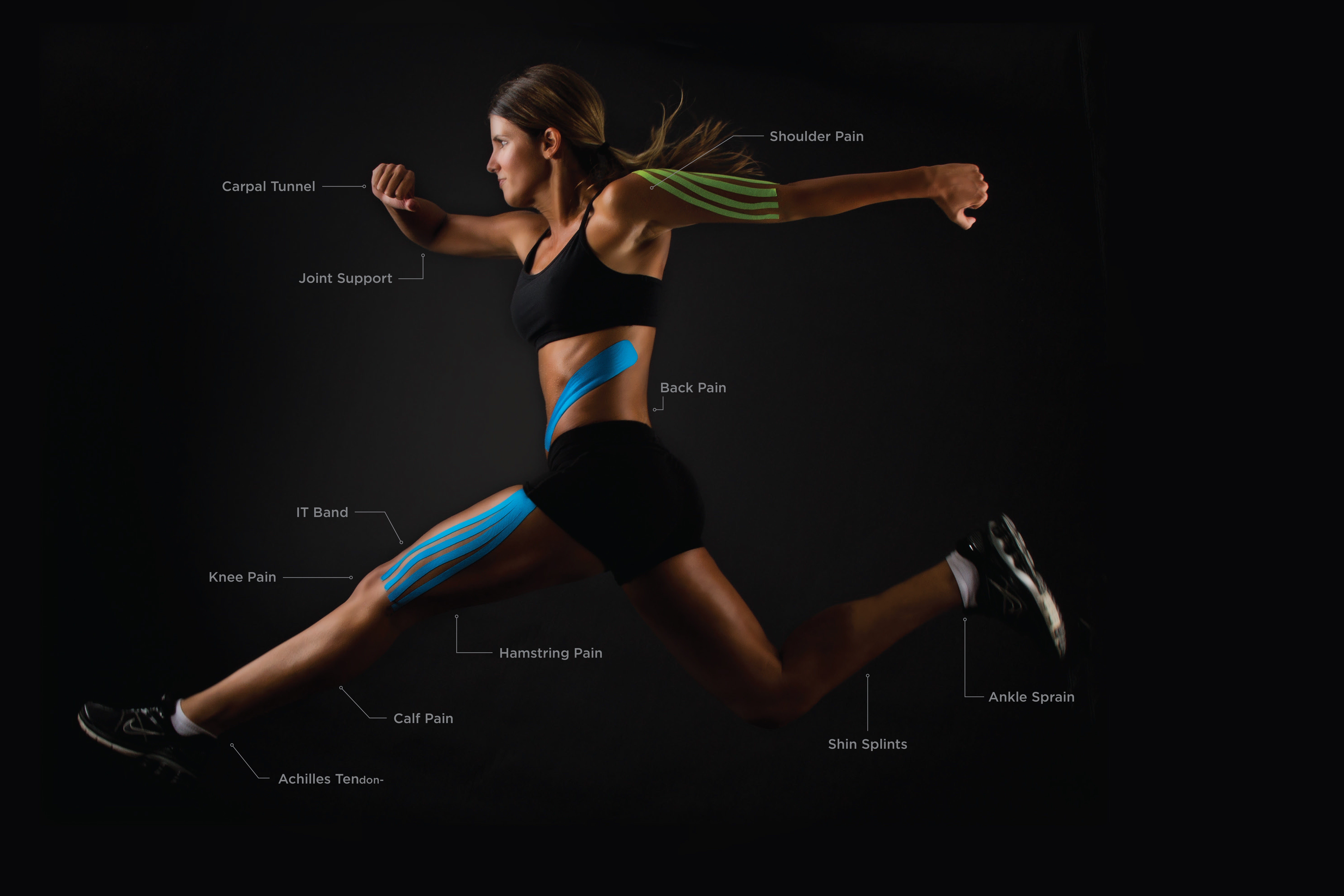 A woman jumping with kinesiology tape all over her