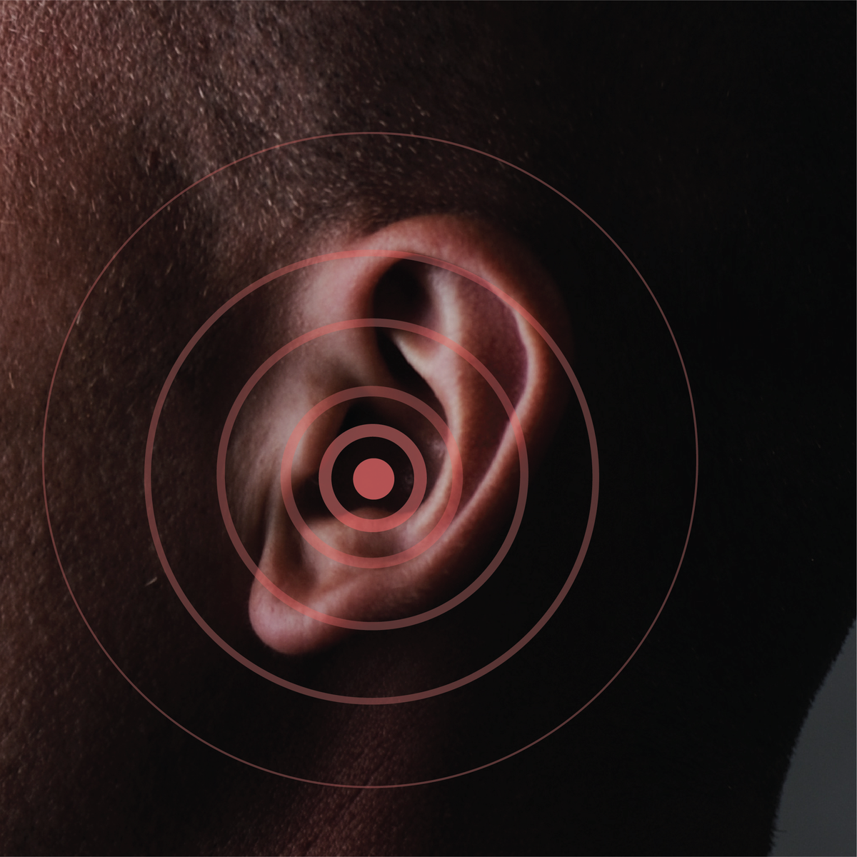 A person’s ear with red circles signifying tinnitus