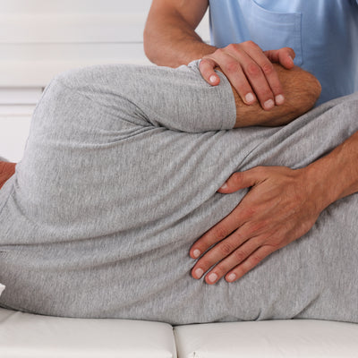 Close up of a person having their back adjusted