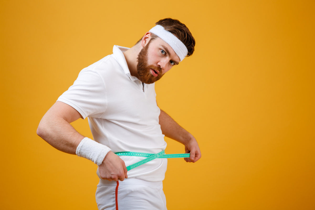 A man with a measuring tape around his waist