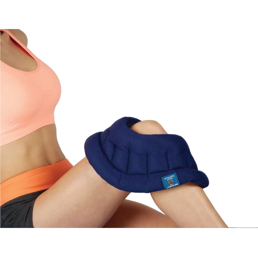 A blue hot/cold wrap on a woman’s knee