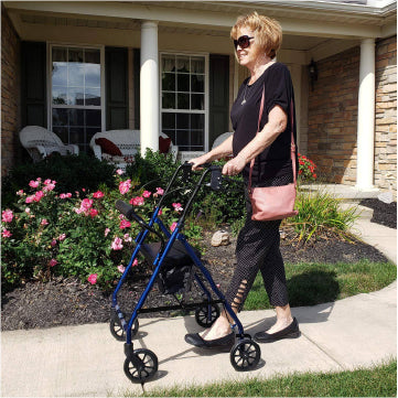 A women walking outside in the garden with the ProBasics Steel Rollator