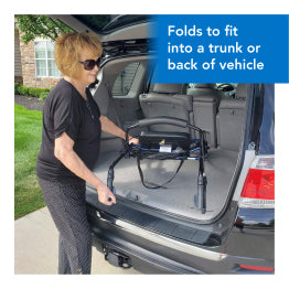 A woman placing the ProBasics Steel Rollator in the back of a trunk. Text, Folds to fit into a trunk or back of vehicle