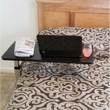 The Roscoe Overbed Table over a bed