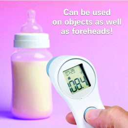 Roscoe Touchless Forehead Thermometer on pink background with baby bottle. Also works on objects!