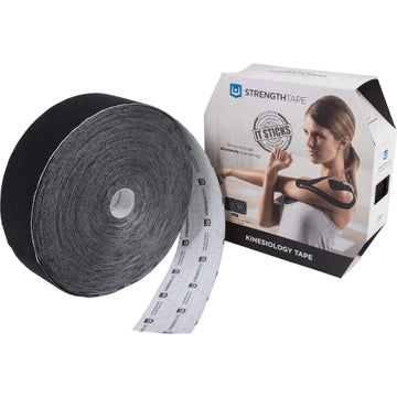 Black kinesiology tape next to packaging