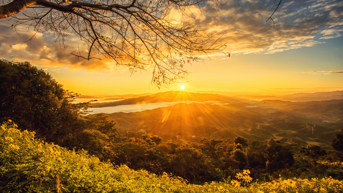 A sun over a mountain range