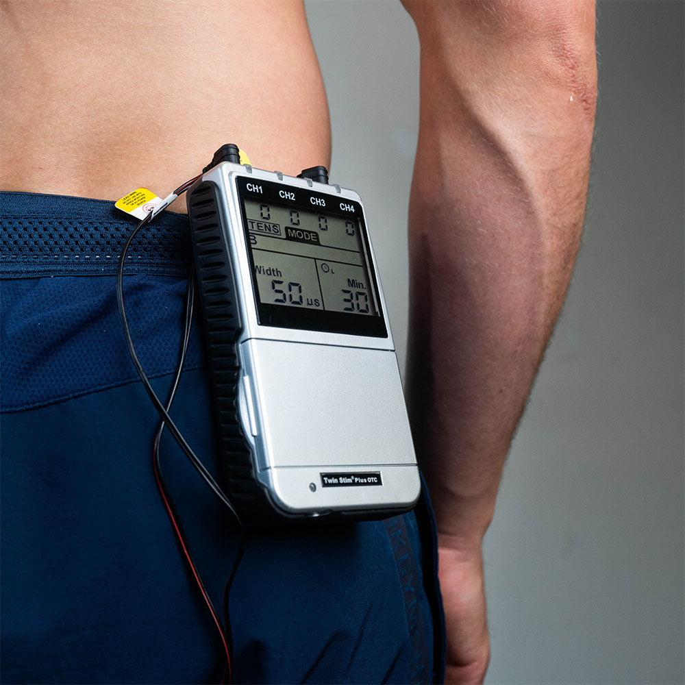 A TENS unit on a man’s shorts