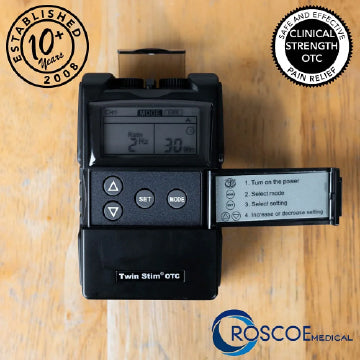 The Twin Stim TENS Unit on a wood surface with the Roscoe logo and two icons 