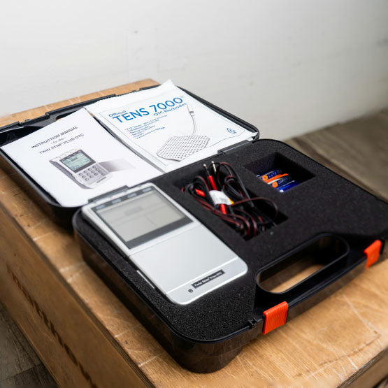 The Twin Stim Plus TENS Unit in its storage case with everything included 