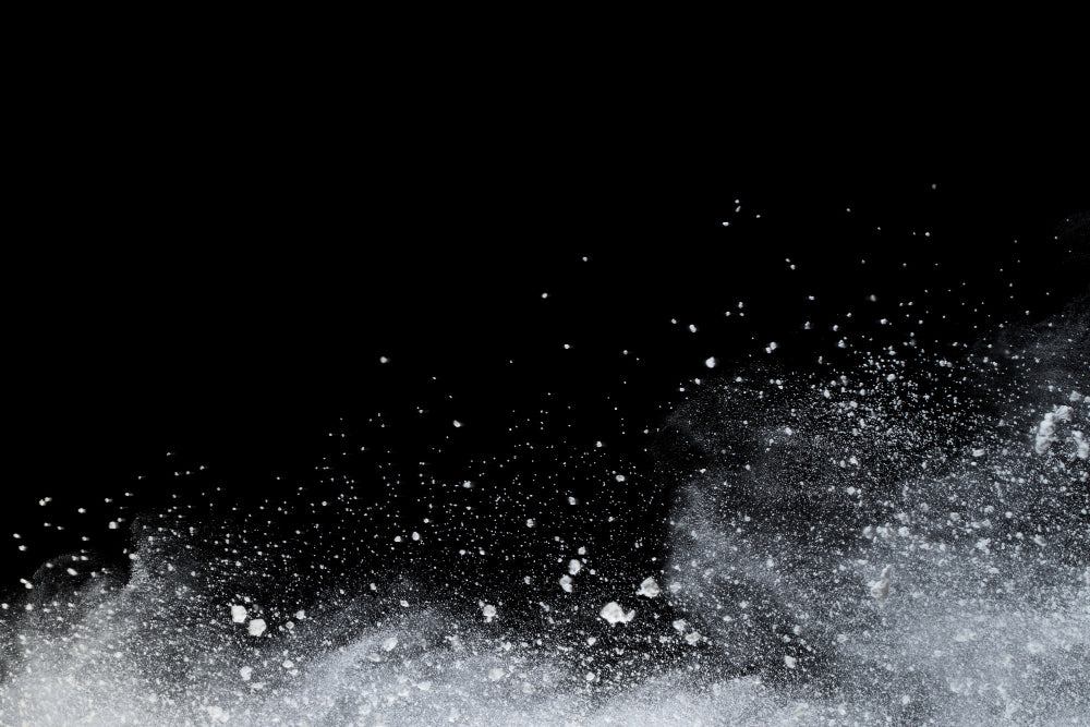 Powdery snow on a black background