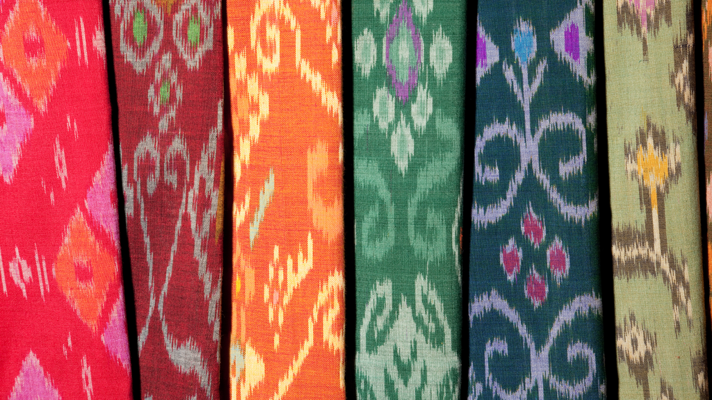 Bolts of colorful ikat print fabric