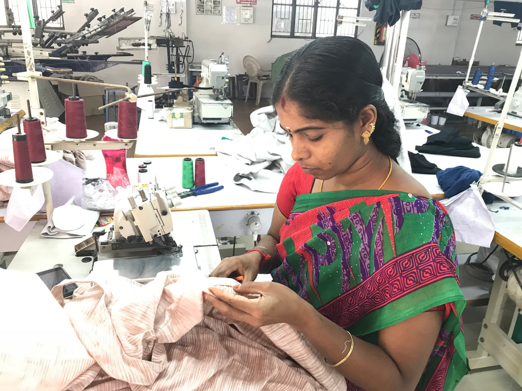 Woman garment worker handcrafts block-printed clothing