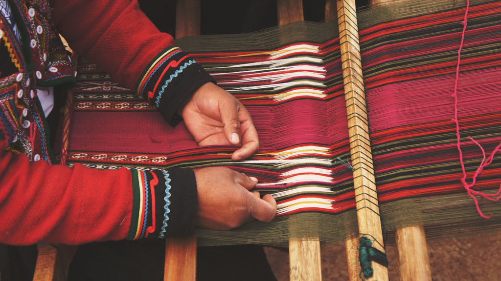 Person works at a hand loom