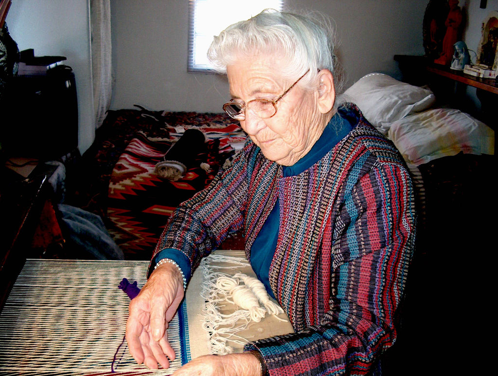 Eppie Archuleta works on a weaving project