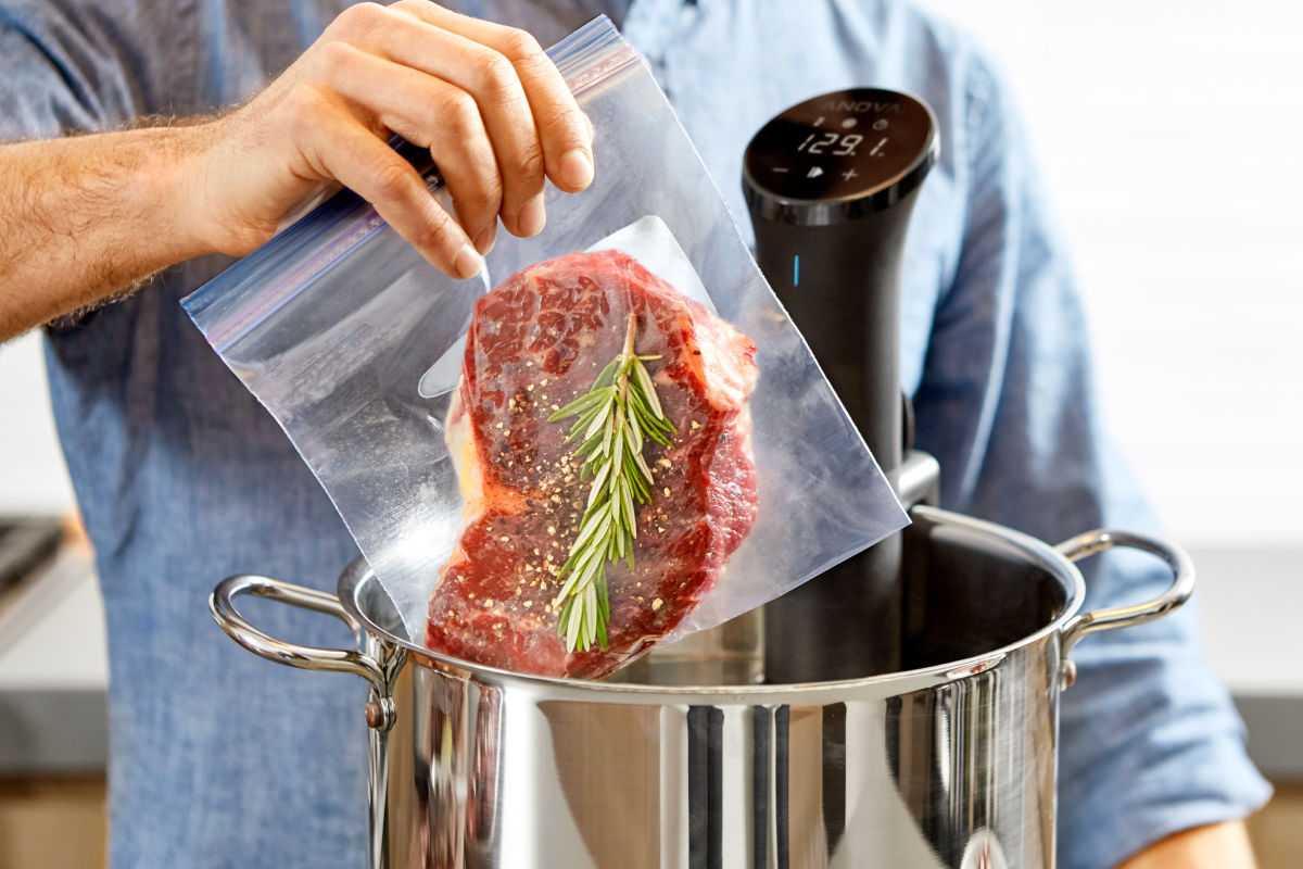 Person cooking with a sous vide kit