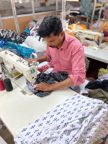 Artisans at work sewing garments