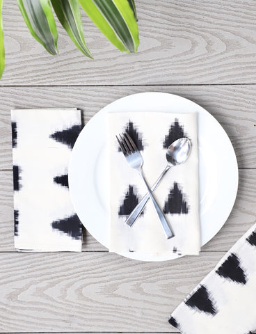 Beautiful cloth napkins with ikat designs make the dinner table inviting