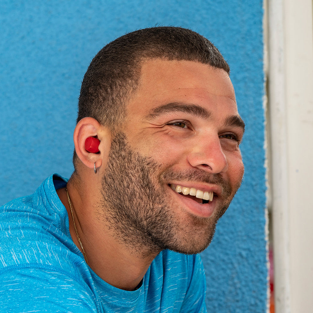 Man smiling and wearing Go Air Pop True Wireless Earbuds in color Rose