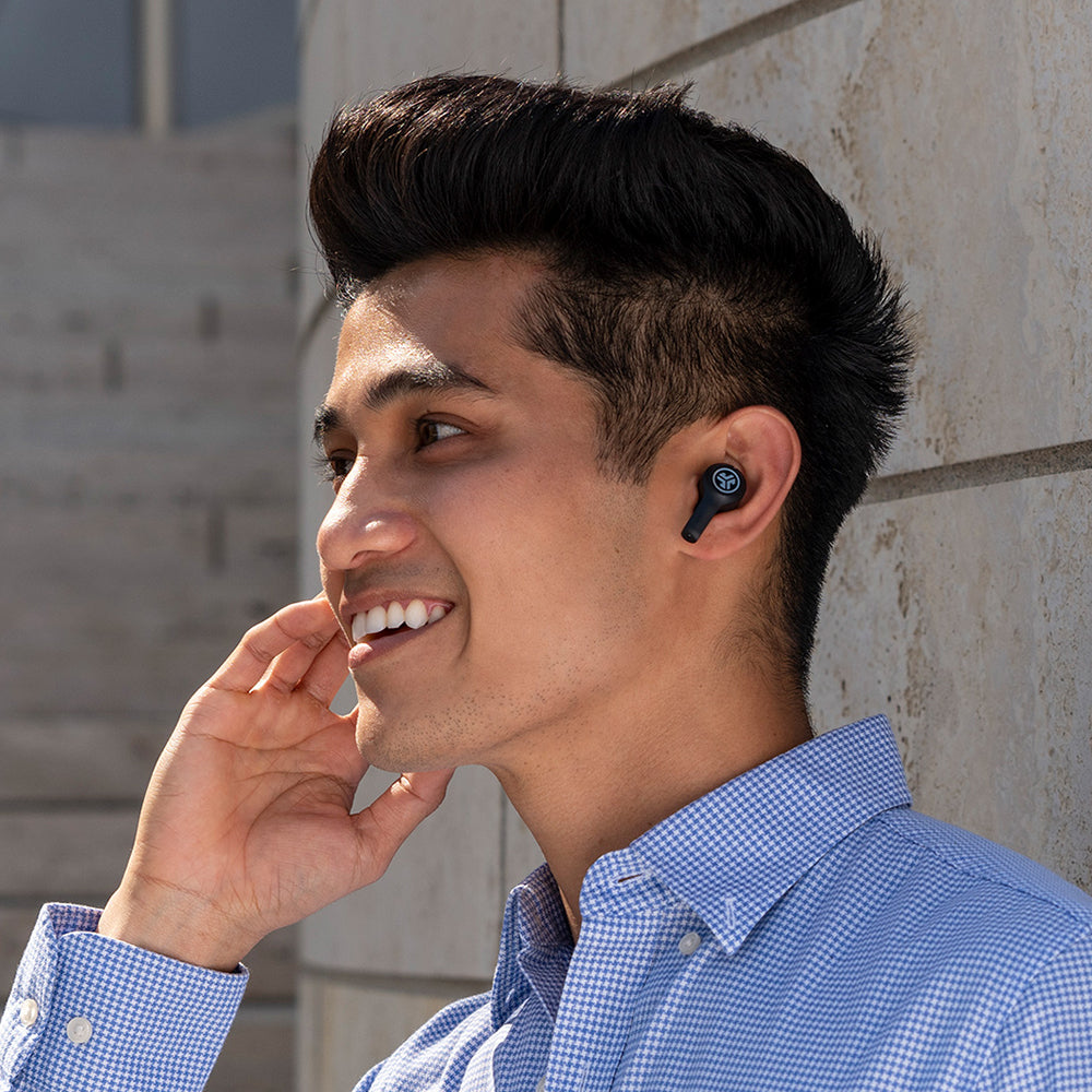 Side profile of man wearing JBuds Air Executive True Wireless Earbuds