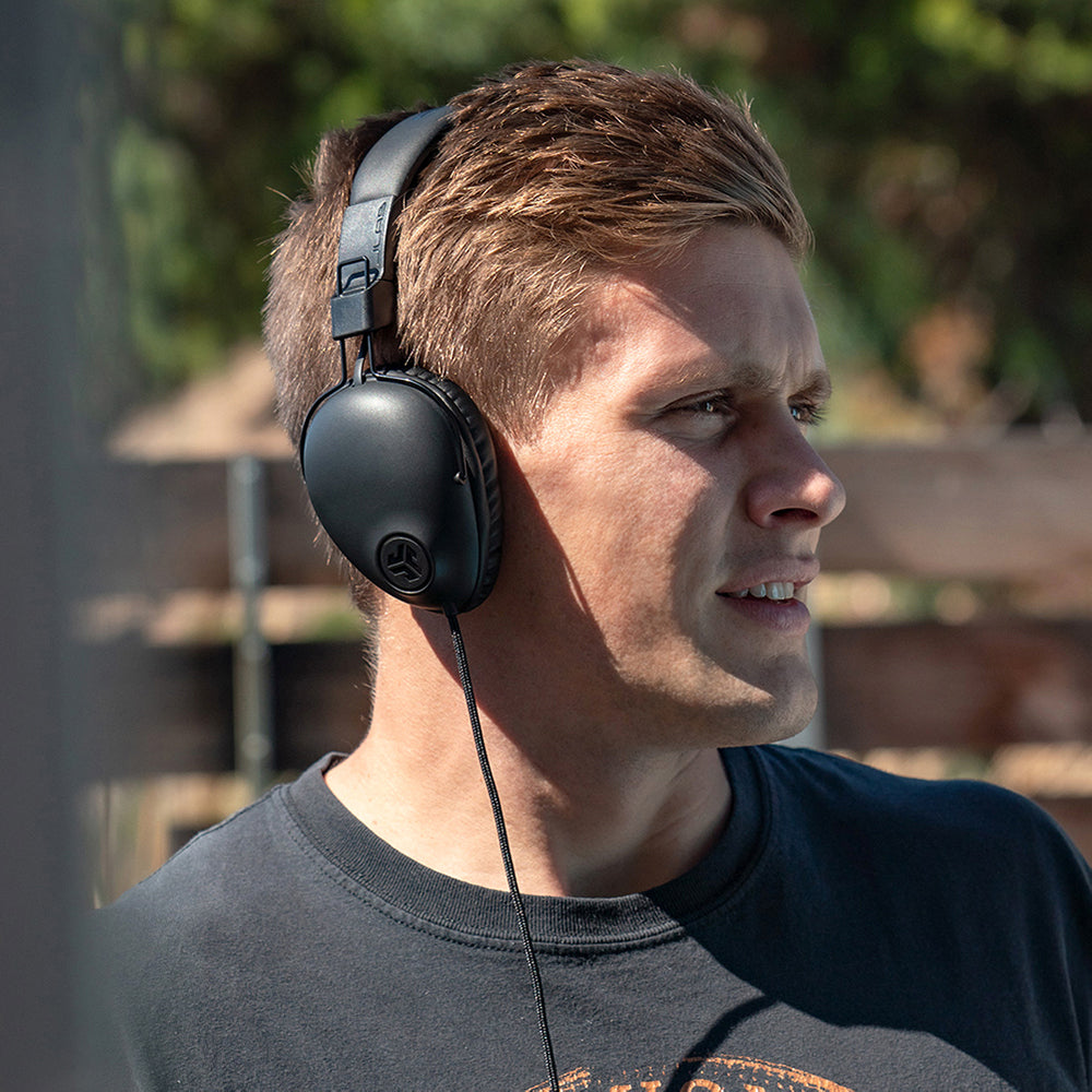 Young man wearing black Studio Pro Over-Ear Headphones