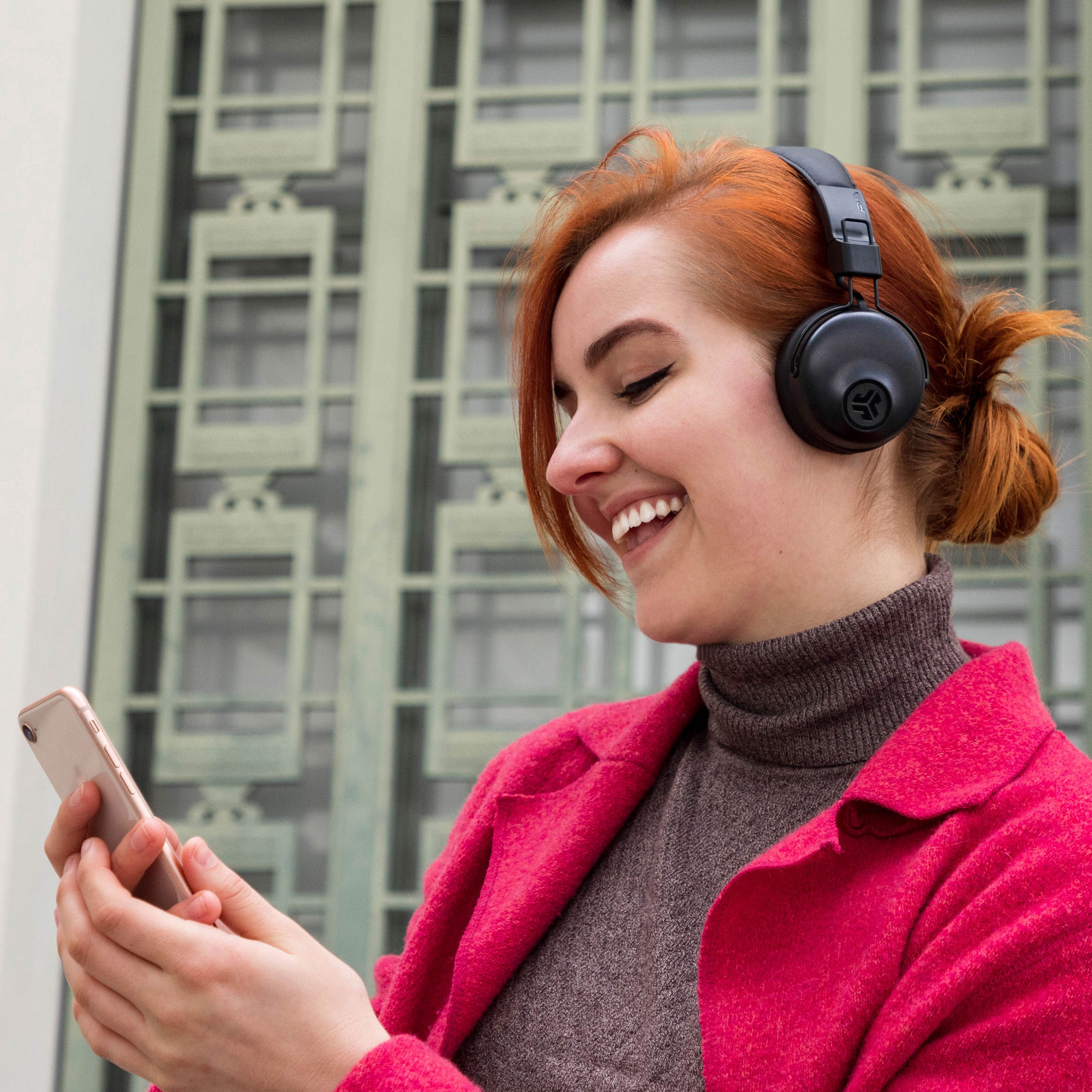 girl wearing Studio Bluetooth Wireless On-Ear Headphones in black