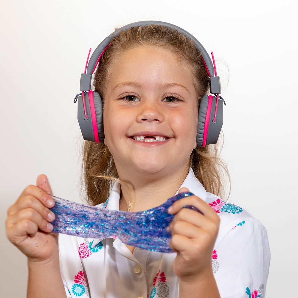 Boy wearing JBuddies Studio Bluetooth On-Ear Headphones in Blue