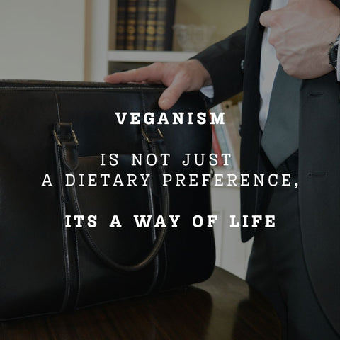 An image of a man in a suit with a briefcase that reads, "Veganism is not just a dietary preference. It's a way of life."