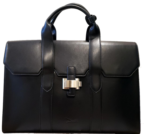 A black handbag with a flap-close top and top handles.