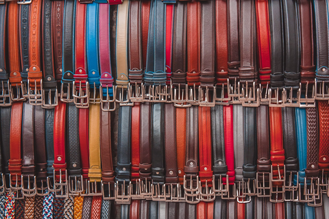 A wall of belts in various colors, patterns, and designs.