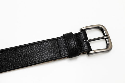A black belt with a rounded silver buckle.