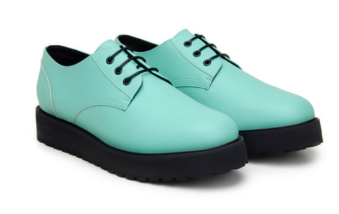 A pair of turquoise platform dress shoes.