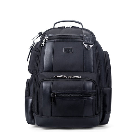 A black backpack with multiple pockets and closures.