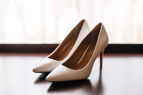 A set of tan closed-toed pointed heels