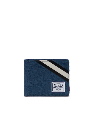 A fabric bifold wallet in navy blue with black and white stripes across the upper right corner.