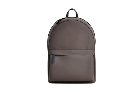 A simple brown two-pocked backpack.