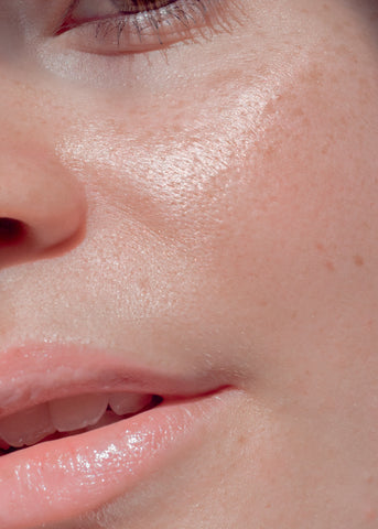 A close up image of a woman's face. She has a fair complexion.